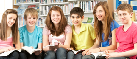 a group of students reading in a library