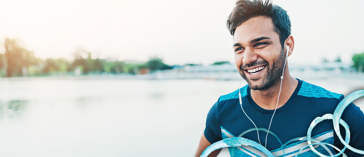 man smiling with earphones