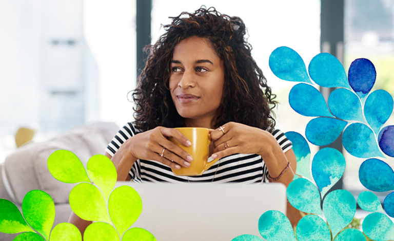 woman holding a cup of coffee in a cafe