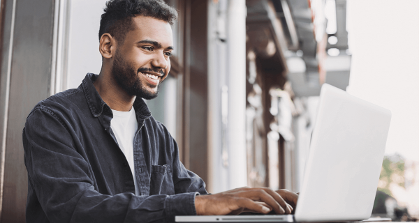 man smiling using the computer